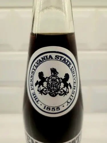 Glass bottle with university logo showcasing PENN STATE NITTANY LIONS VINTAGE 1982