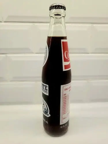 Coca-Cola commemorative glass bottle featuring Penn State Nittany Lions vintage 1982 design