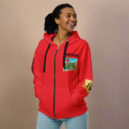 Woman wearing a red unisex zip hoodie with graphic design, perfect for casual wear
