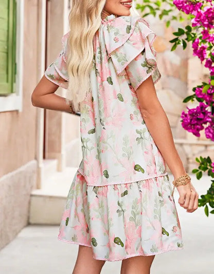 Pink floral tiered mini day dress with ruffle sleeves and a drop-waist fit