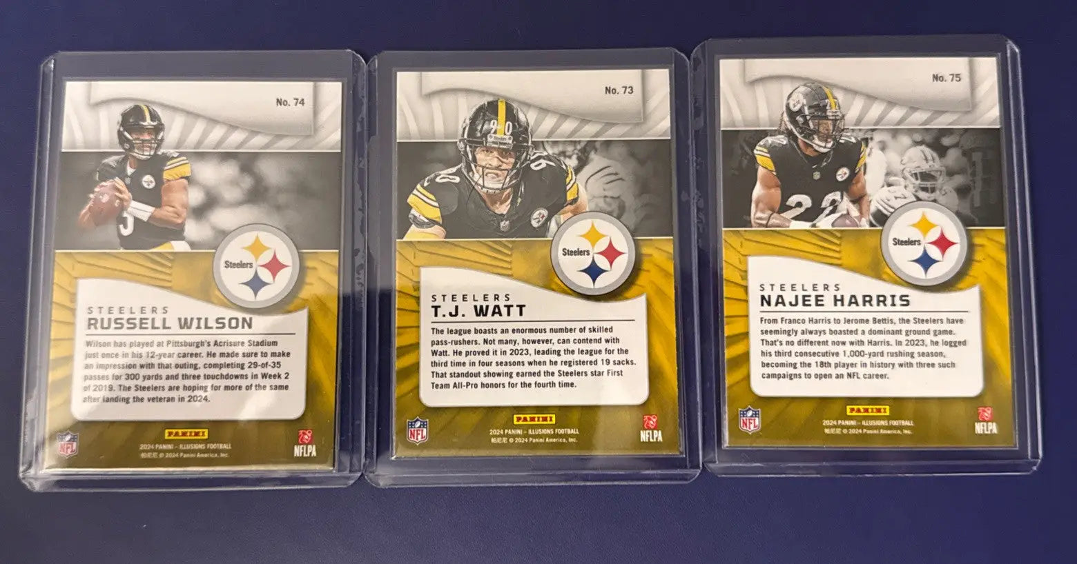 Pittsburgh Steelers lot featuring three 2024 Panini Illusions trading cards in protective cases