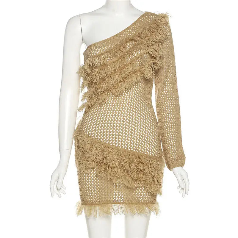 Tan knitted mini dress with inclined shoulder and fringe details, perfect for stylish business days