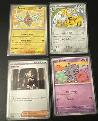Four sleeved Pokémon TCG Surging Sparks trading cards in a lot of 11 cards