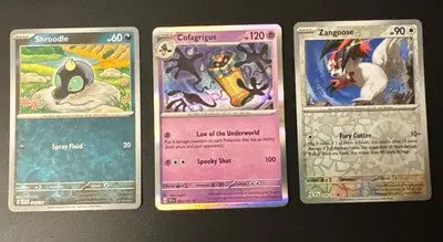 Pokemon Surging Sparks trading cards displayed in a lot of 12 cards for collectors