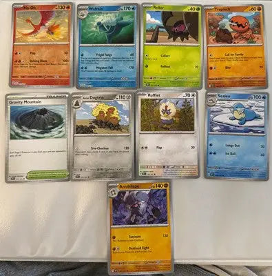 Pokémon TCG Surging Sparks lot of trading cards featuring vibrant Pokémon characters