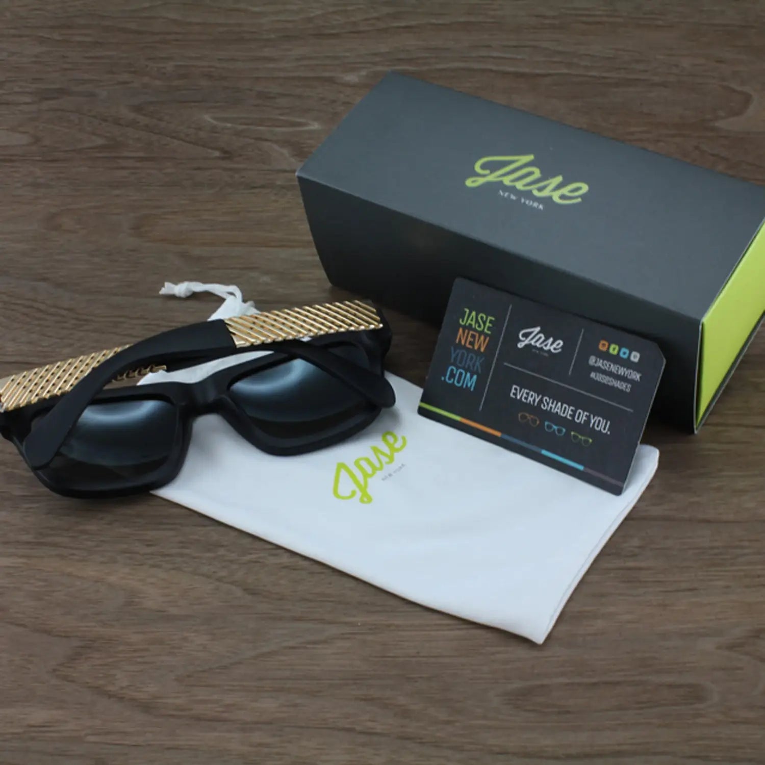 Polarized Fit Oversized Sunglasses with gold textured arms, box, cloth, and info card