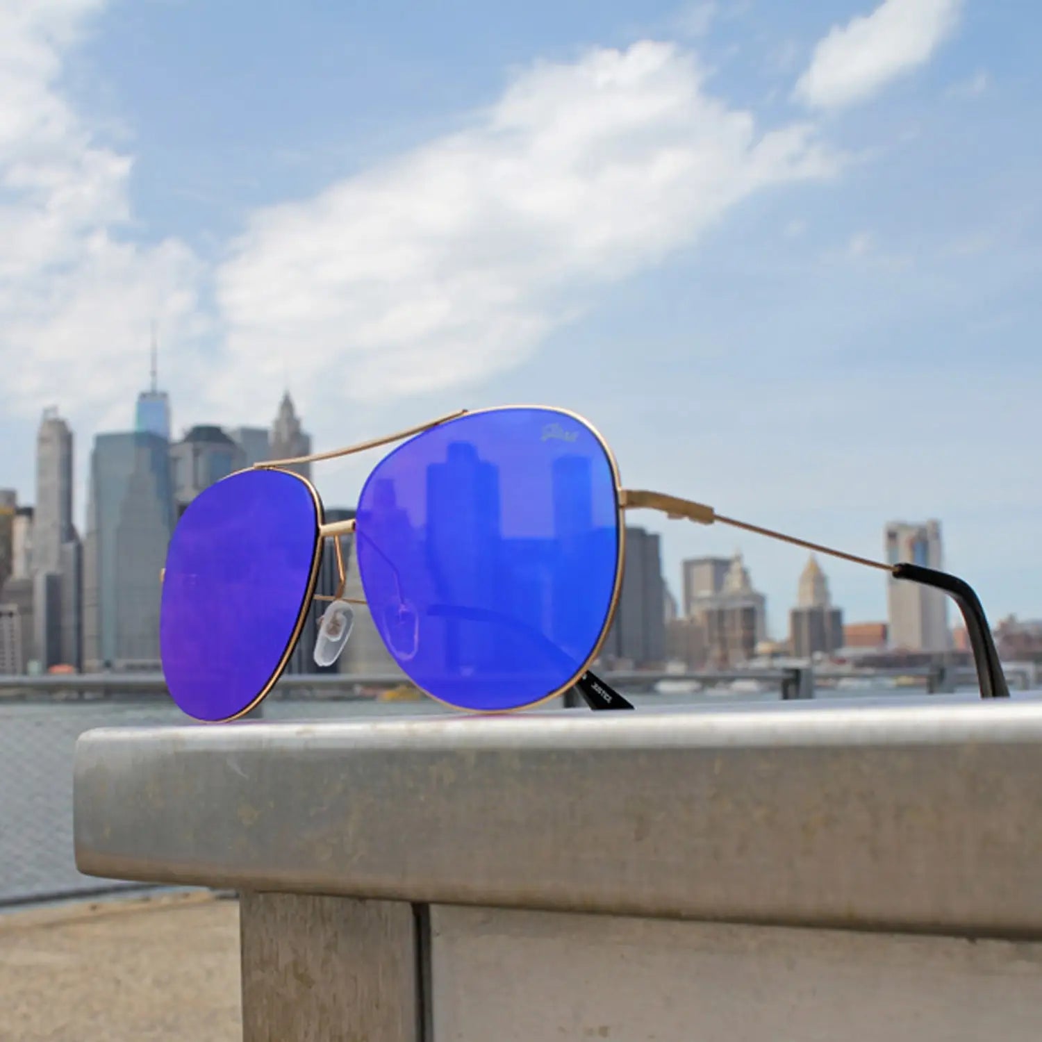 Gold-framed polarized mirrored metal frame sunglasses with reflective blue lenses