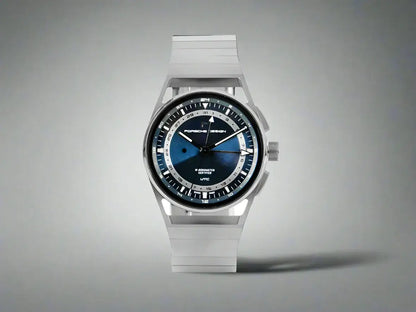 Silver Porsche Design 1919 Automatic Watch with blue face and white hands, showcasing premium watch features