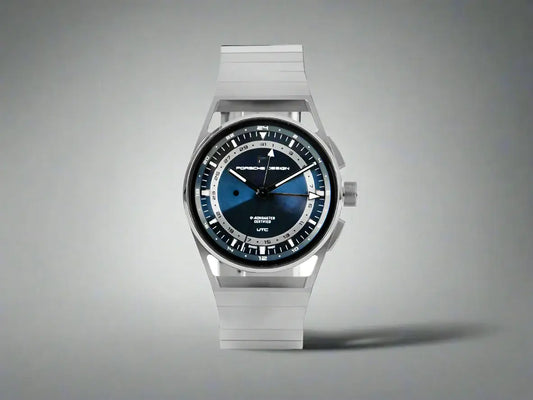 Silver Porsche Design 1919 Automatic Watch with blue face and white hands, showcasing premium watch features