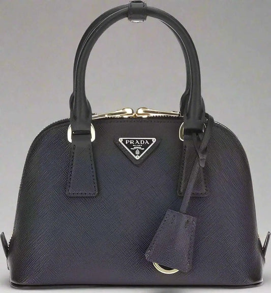 Prada black leather handbag with top handles and key clochette for elegant style