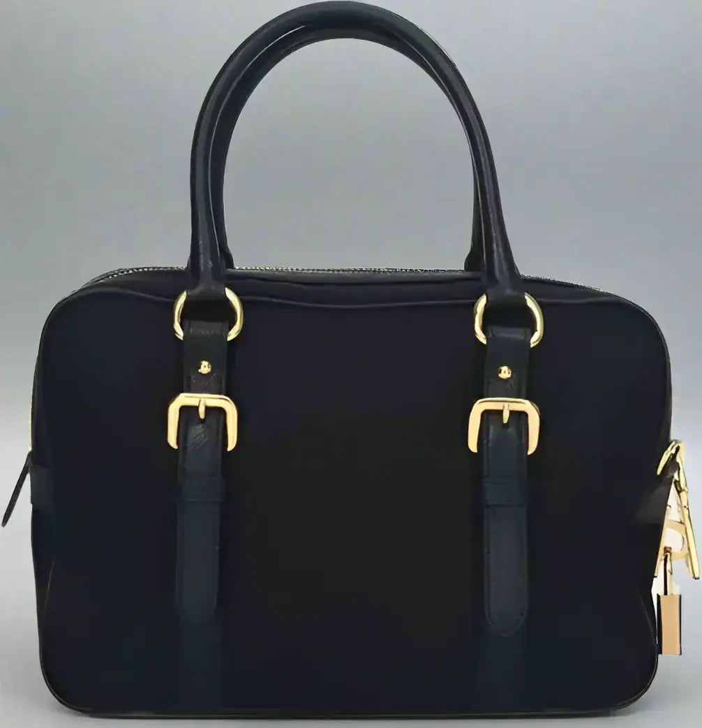 PRADA black logo nylon top handle bag with gold buckles and padlock