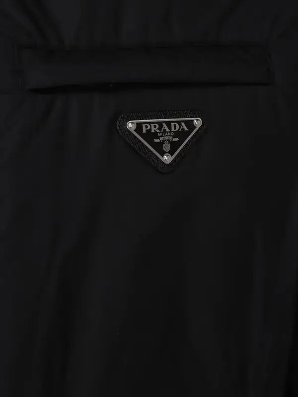 Black Prada men’s swim shorts with iconic logo plaque and zip closure