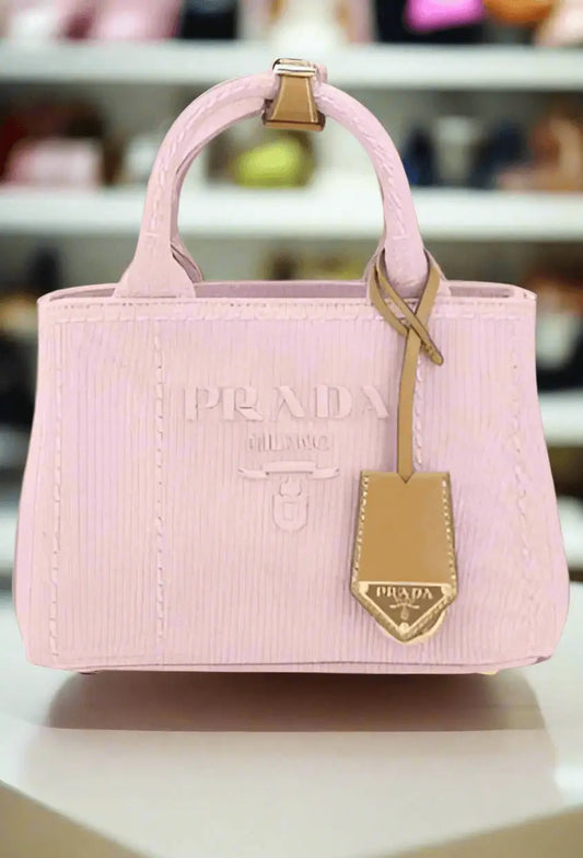 Light pink fabric handbag with embossed stripes and matching hang tag for Prada Pink Fabric Handbag