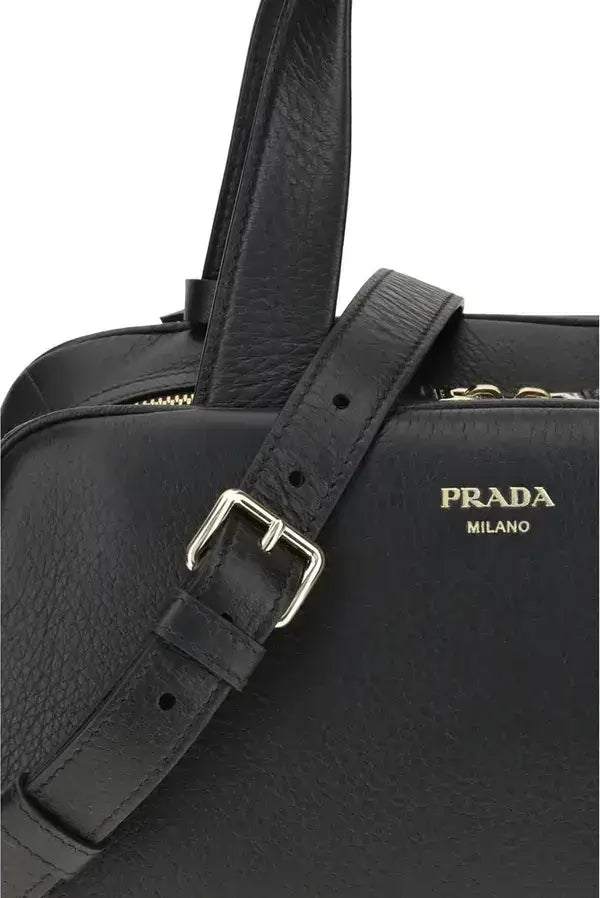 Black leather Prada handbag with silver buckle and shoulder strap for women