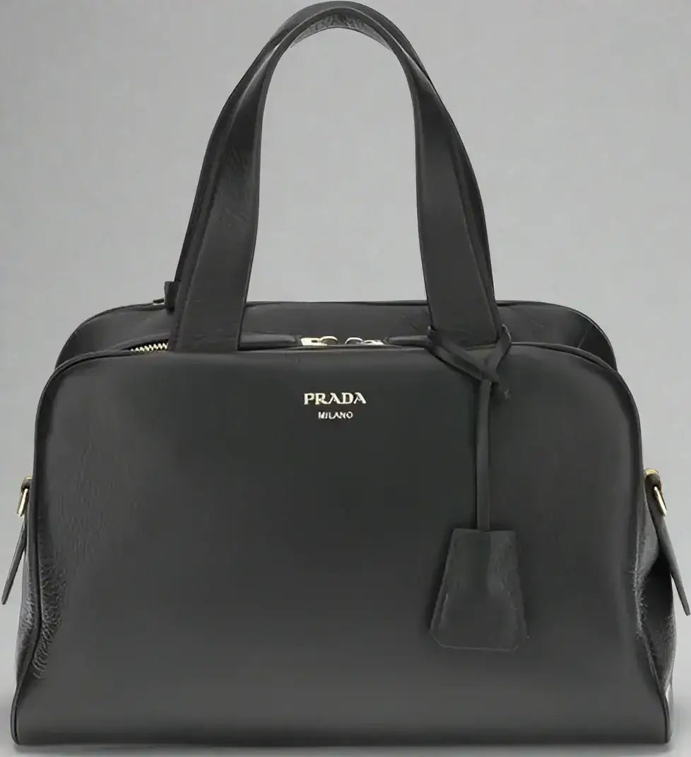 PRADA women’s black leather handbag with top handles and zipper closure