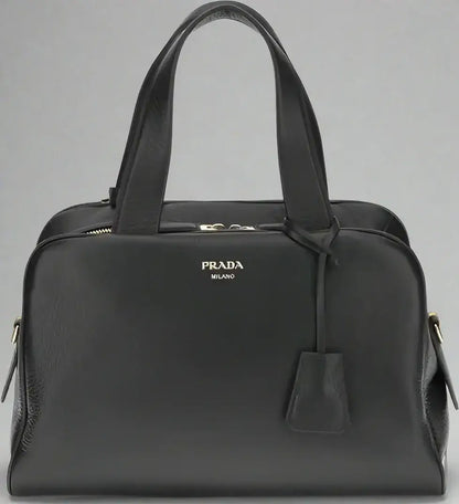 PRADA women’s black leather handbag with top handles and zipper closure