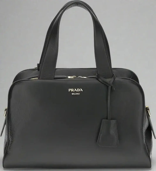 PRADA women’s black leather handbag with top handles and zipper closure
