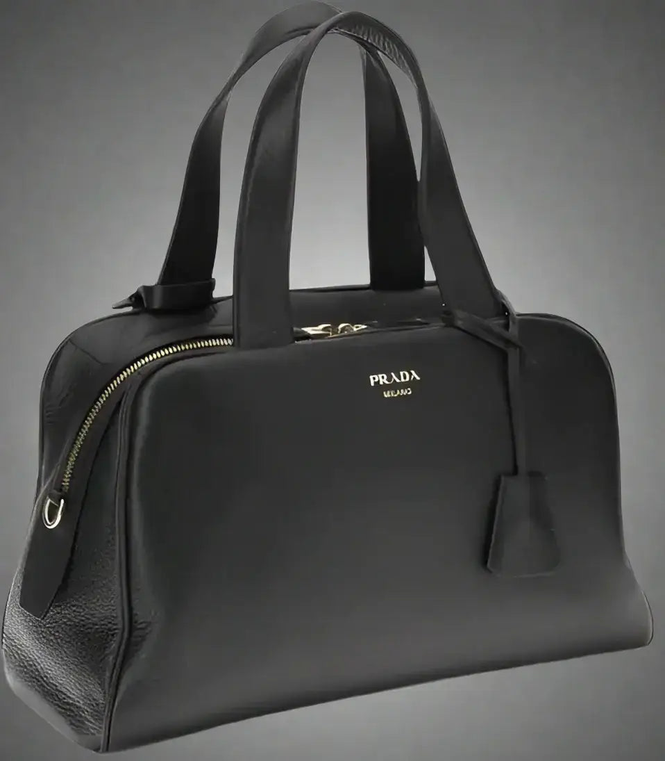 PRADA women’s black leather handbag with top handles and zipper closure