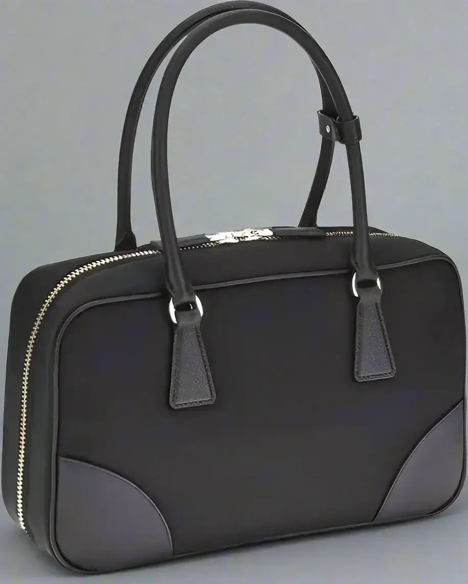 Black rectangular PRADA Re-Nylon Handbag with dual top handles and silver zippers