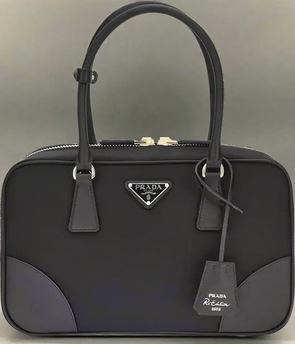 Black Prada Re-Nylon shoulder bag with top zipper closure for women