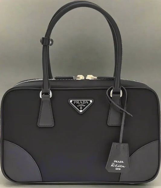 Black Prada Re-Nylon shoulder bag with top zipper closure for women