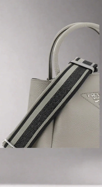 PRADA women’s grey grained leather handbag with striped fabric strap for stylish accessories