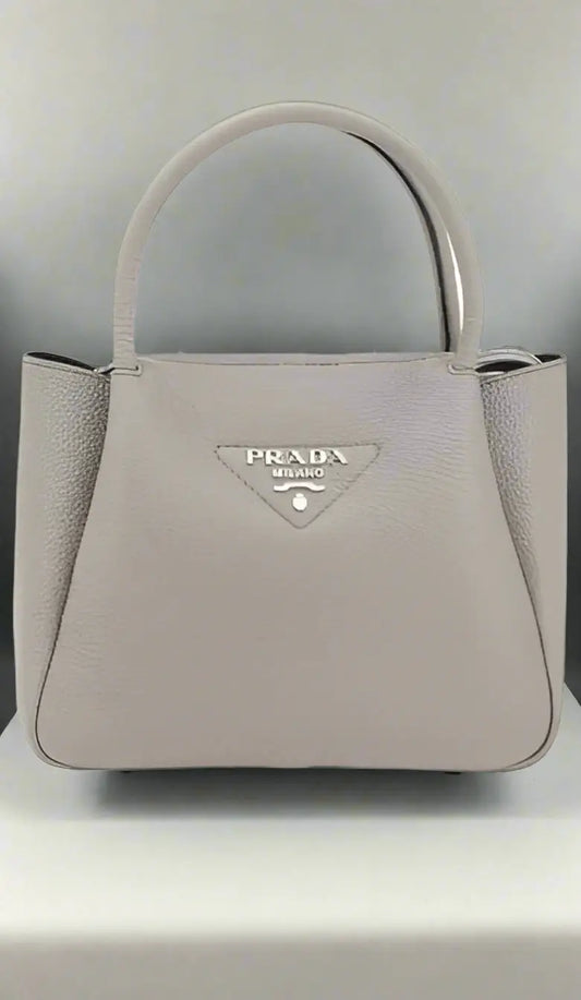 Light grey grained leather handbag with top handle for PRADA women’s GRAINED HANDBAG