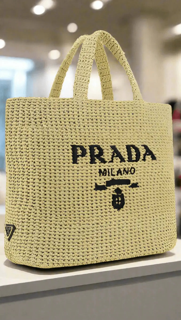 Light yellow woven raffia Prada shopping handbag with black logo for woven raffia shopping