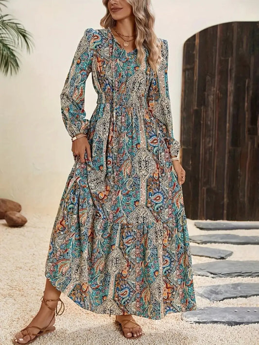 Printed tie neck long sleeve maxi dress with colorful paisley print and shirred bodice