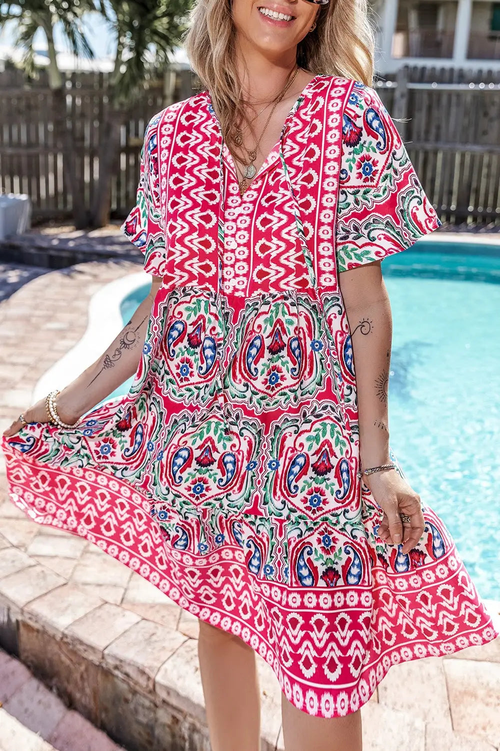 Printed tie neck short sleeve dress on a woman, stylish and perfect for summer wear