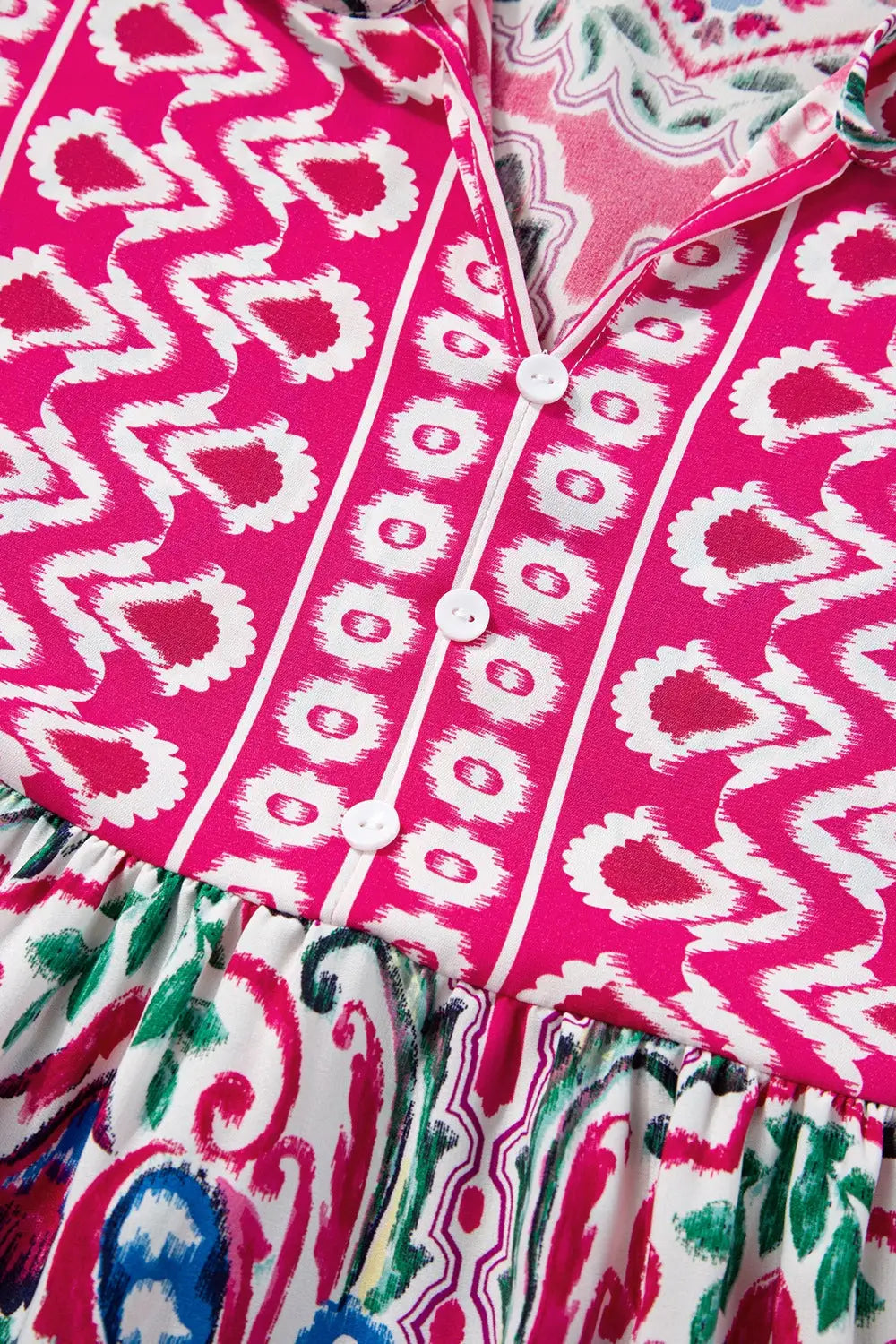 Pink and multicolored printed tie neck short sleeve dress with button-up placket