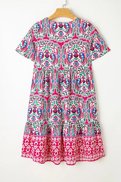 Pink and white tribal print tiered babydoll dress with tie neck short sleeves