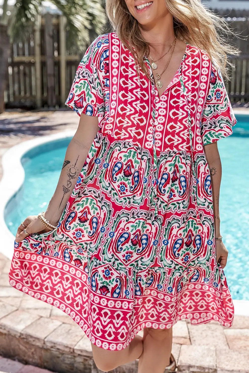 Printed tie neck short sleeve mini dress with vibrant red and white bohemian print