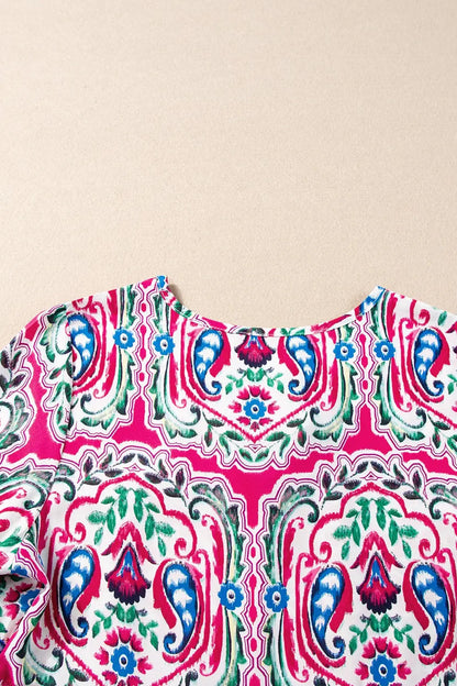 Vibrant paisley print top with a rounded neckline, perfect as a printed tie neck short sleeve dress