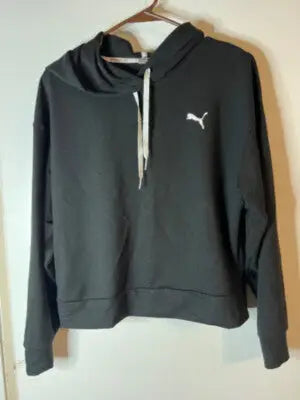 Black Puma Women’s Hoodie with white drawstrings displayed on a model