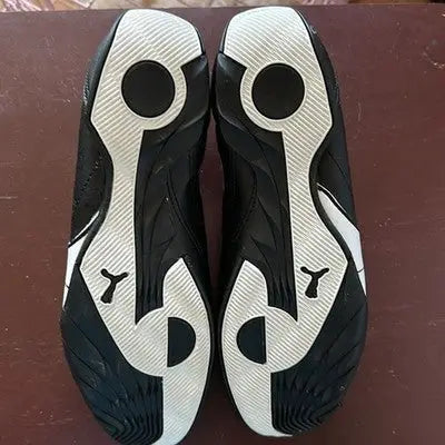 Black and white Puma Rendon Move men’s shoes with rubber outsole and synthetic leather upper