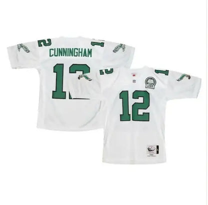 Two white Philadelphia Eagles jerseys with green numbers and lettering featuring Randall Cunningham 1992 design