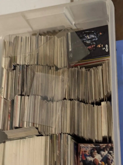 Stack of comic books and magazines with assorted trading cards from the 80s to 00s