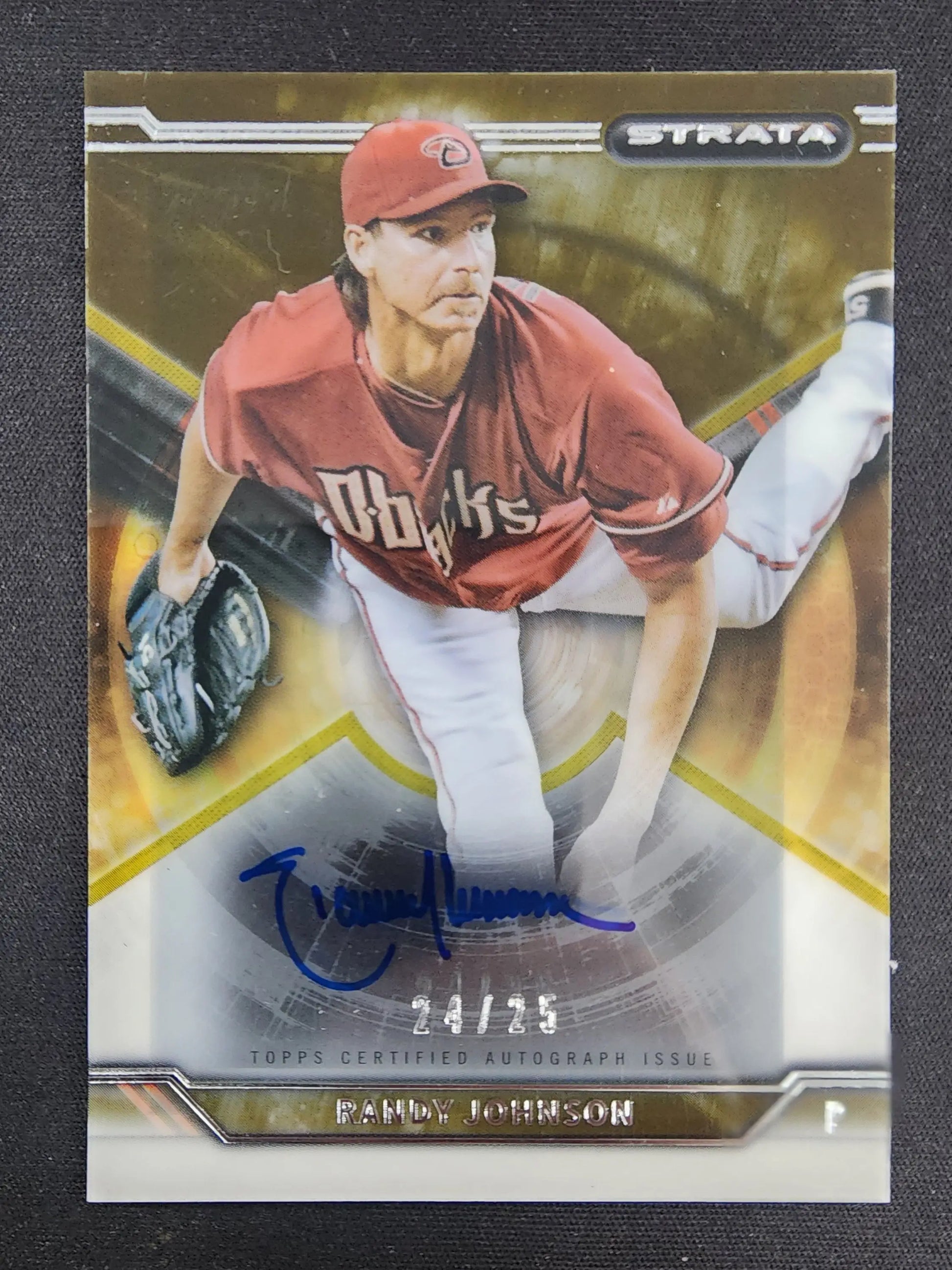 Signed Randy Johnson Strate Baseball Auto card in red Phillies uniform mid-delivery
