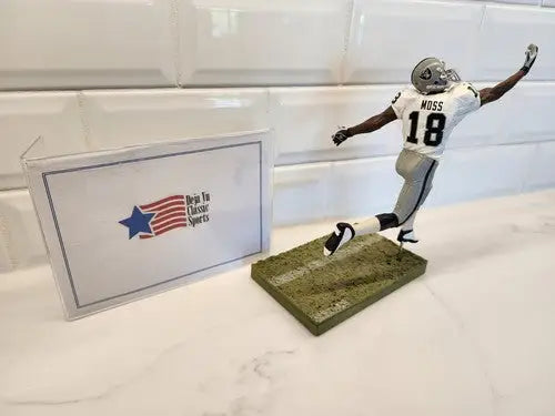 Randy Moss Rare McFarlane action figure displaying iconic Raiders memorabilia