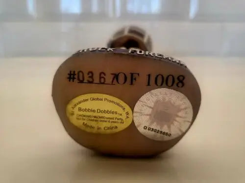 Brown bobblehead duck featuring autographed Chuck Foreman with limited edition #367/1008