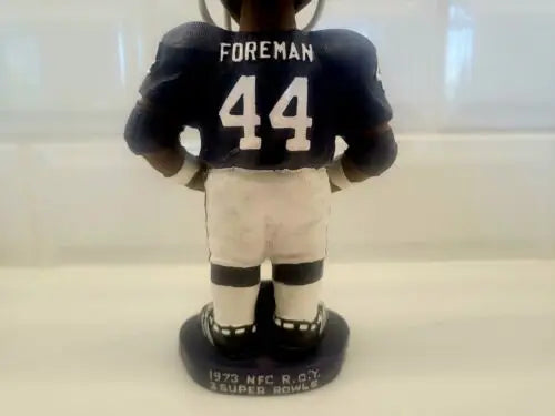 Autographed Chuck Foreman bobblehead showcasing Minnesota Vikings #44 memorabilia