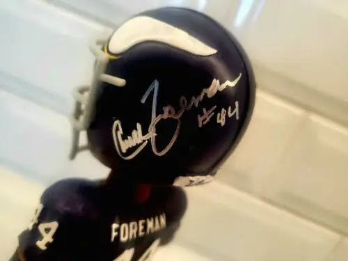 Signed Chuck Foreman bobblehead showcasing autographed Chuck Foreman memorabilia