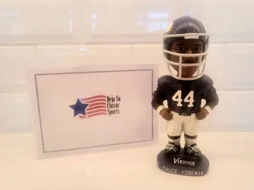 Rare NFL Autographed Chuck Foreman #44 Minnesota Vikings Bobblehead on display