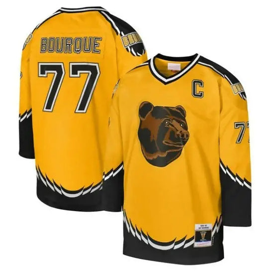 Yellow and black hockey jersey with Boston Bruins logo and blue line captain patch