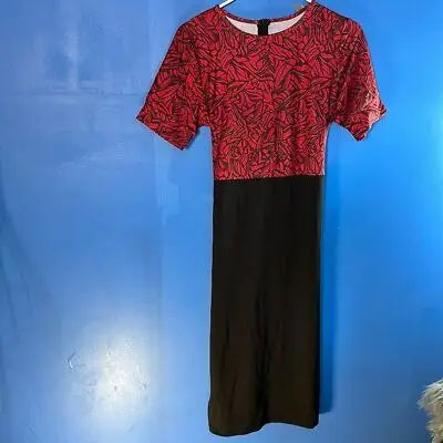 Red and black patterned midi dress with short sleeves and rear zip in size medium
