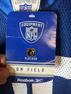 Blue Reebok NFL On Field Jersey hang tag displayed for Colts 28 product
