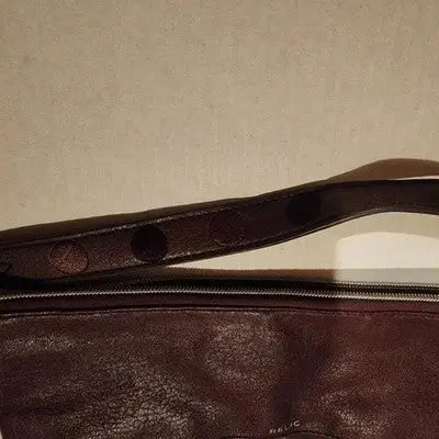 Relic Brown Faux Leather Handbag with Chevron Design, patterned strap, and zip closure