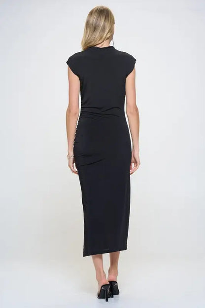 Woman in a black sleeveless ruched dress with a slit from Renee C. Sleeveless Ruched Dress collection