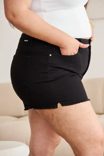 Black denim shorts with frayed hem, pockets, high waist, and tummy control features